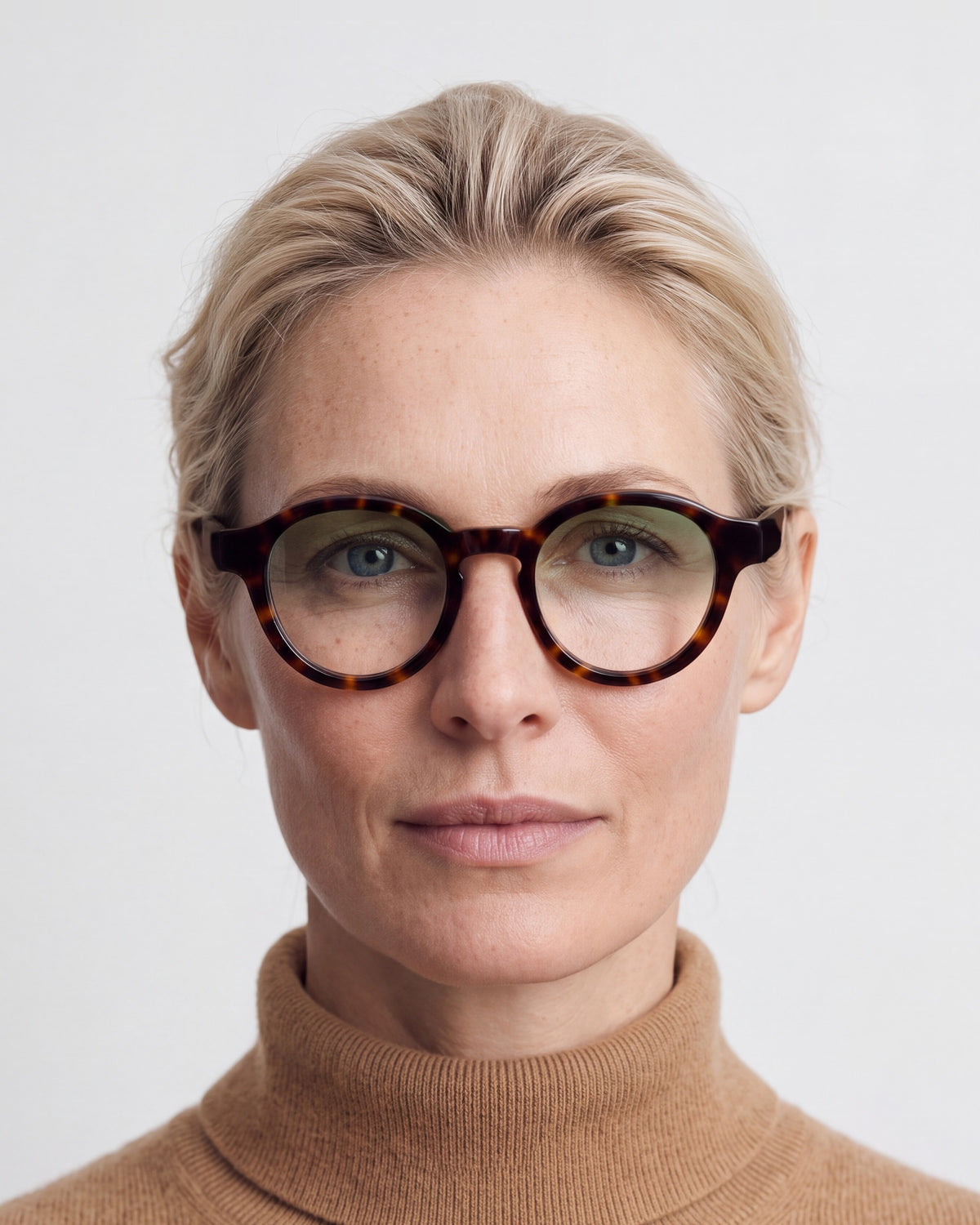 Nora in tortoiseshell, worn, Sage lenses